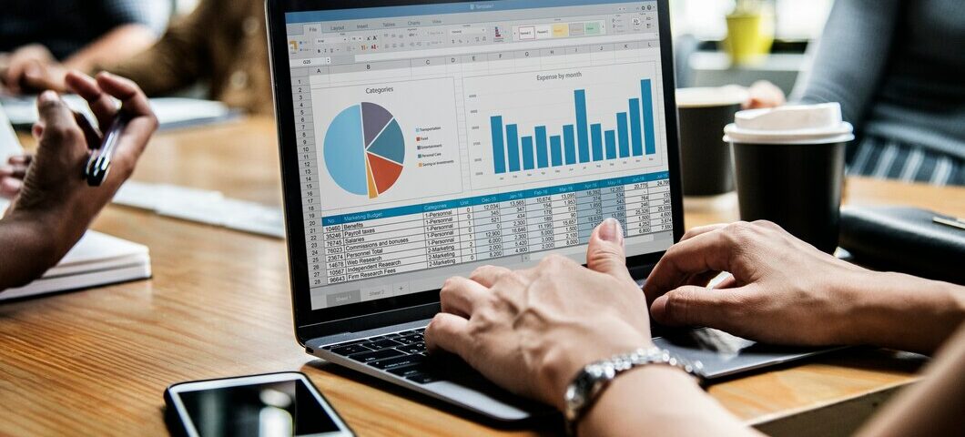 business people working laptop view grafics